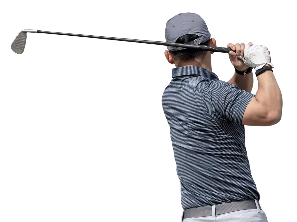 Golfer in striped shirt and gray cap swinging a golf club, viewed from behind.